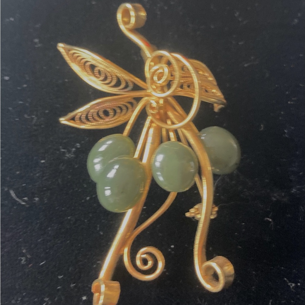 Whimsical gold-plated pin with jade stones